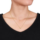 Yellow-plated initial pendant necklace letter K option on model by Lord & Taylor