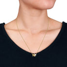 Yellow-plated initial pendant necklace letter N option on model by Lord & Taylor