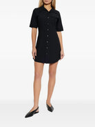 Black AMI Paris wool shirt dress, side angle view on model