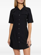 Black wool shirt dress by AMI Paris, back view on model