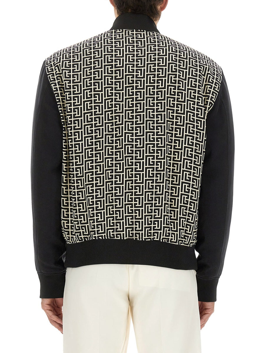 MONOGRAMMED VARSITY JACKET WITH PATCHES Balmain