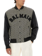 MONOGRAMMED VARSITY JACKET WITH PATCHES Balmain