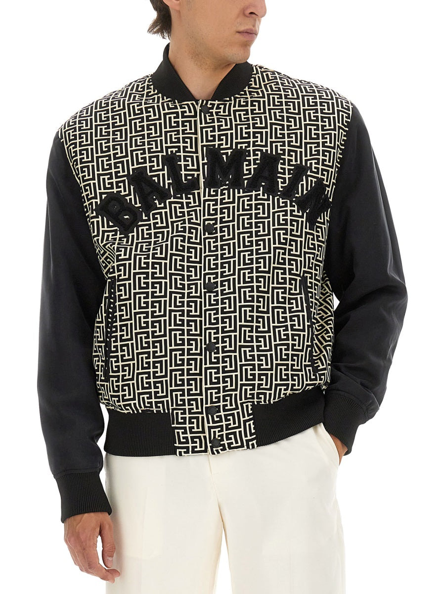 MONOGRAMMED VARSITY JACKET WITH PATCHES Balmain