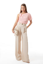 Beige wide-leg trousers styled with coordinating pieces by Lord & Taylor Heritage