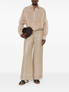 Beige cotton shirt by Brunello Cucinelli, back view showing loose fit