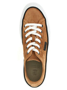 Brown suede low-top sneakers by Brunello Cucinelli, sole view showing rubber outsole