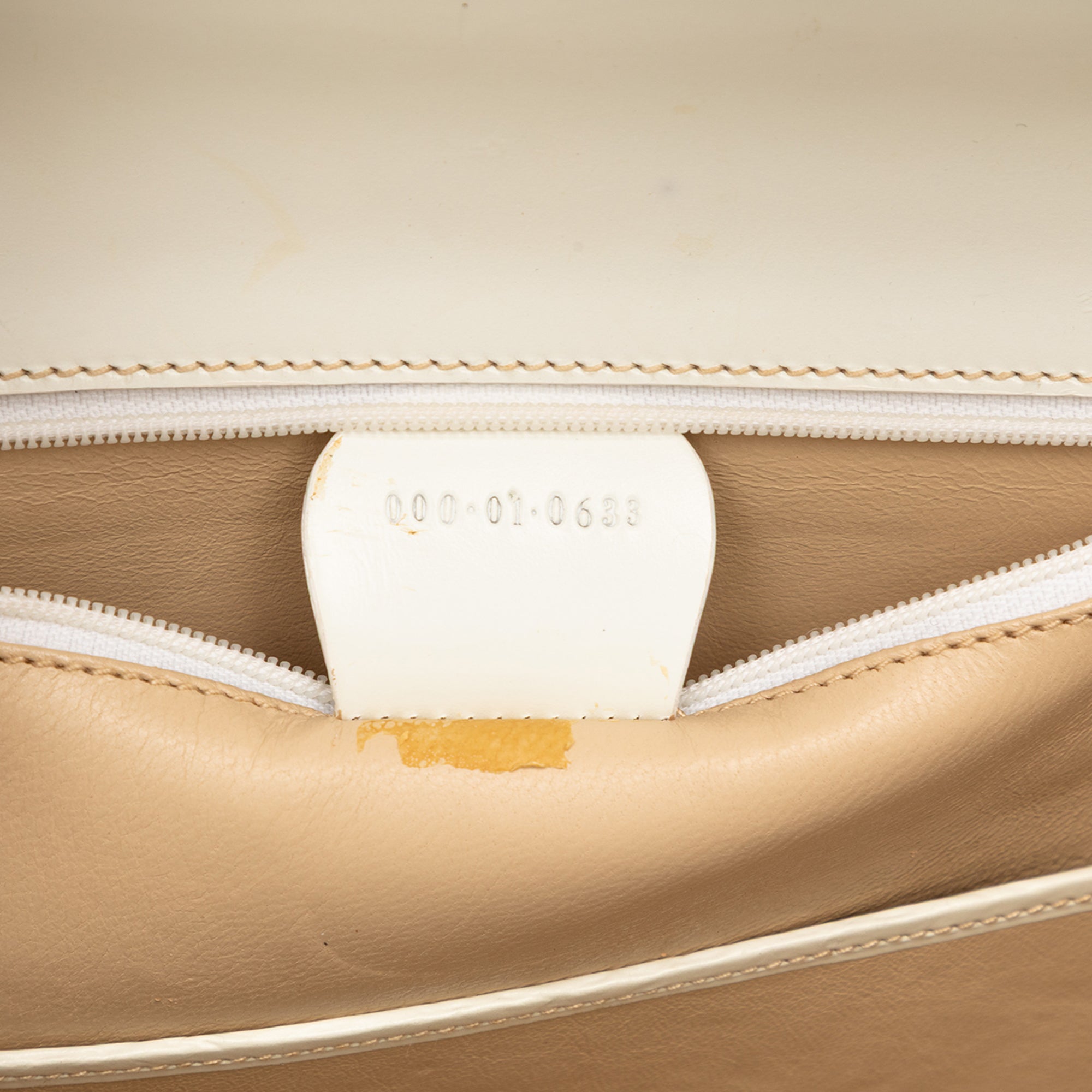 White calfskin Gucci satchel bottom view showing wear by Gucci