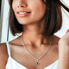 Blue sapphire tennis necklace by Lord & Taylor worn on model, showing drape and pendant placement