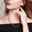 Blue sapphire heart tennis necklace worn on model by Lord & Taylor