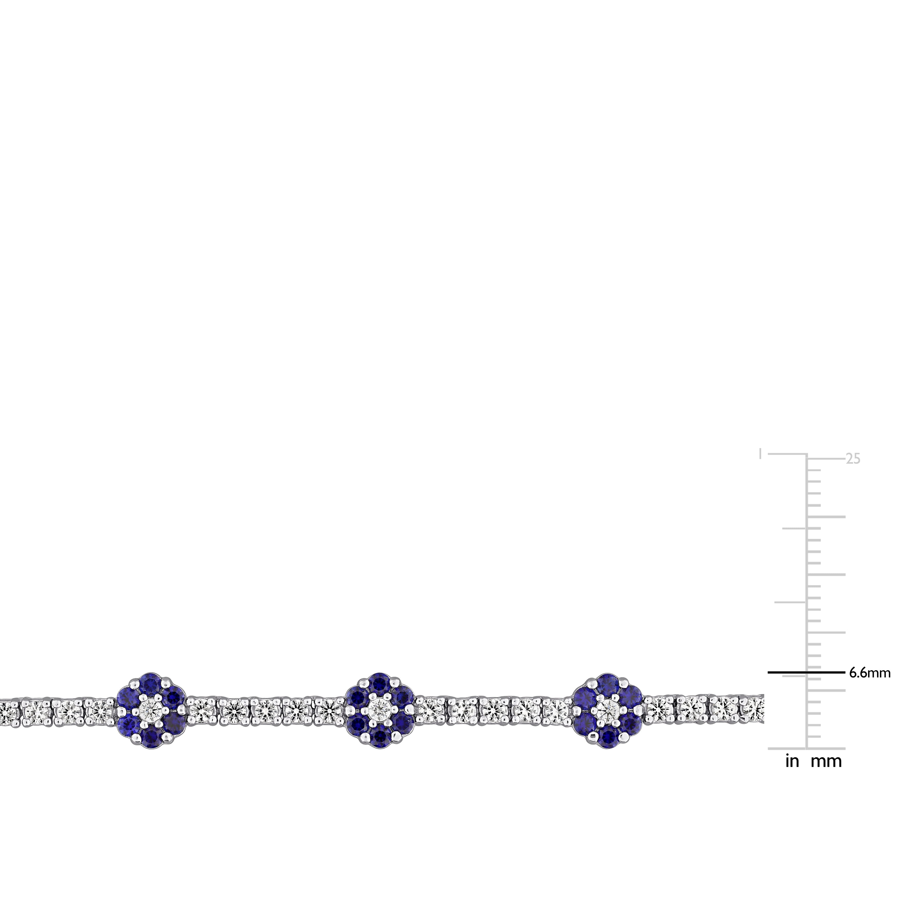 Blue sapphire flower station necklace, close-up of floral motif detail