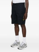 Stone Island bermuda shorts showing signature badge detail on cargo pocket