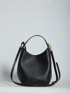 Black calfskin leather small hobo bag with top handle by Celine, front view