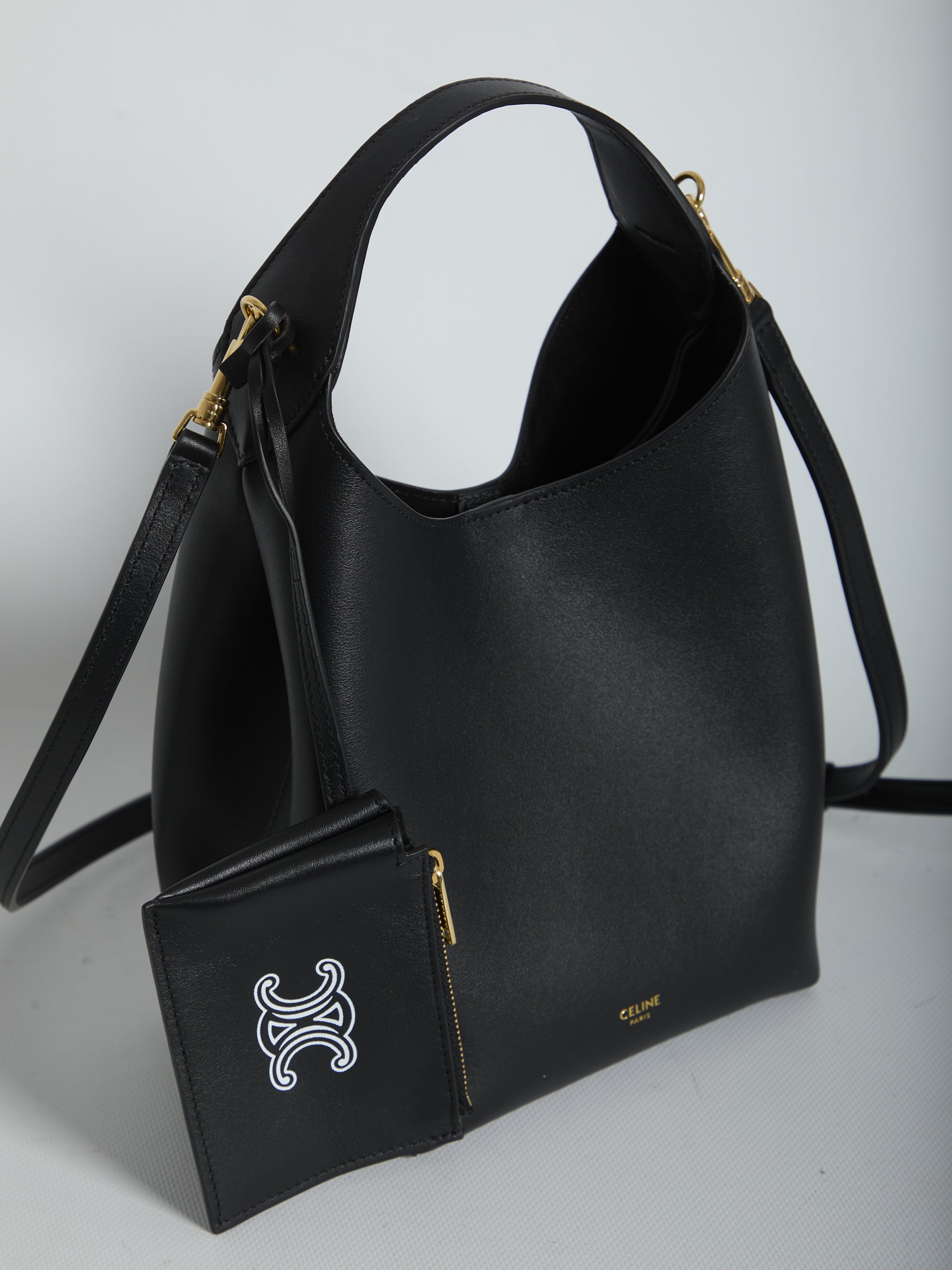 Celine black leather hobo bag with Triomphe logo zip pochette, back view