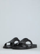 Black Celine Triomphe slide sandal, side profile view