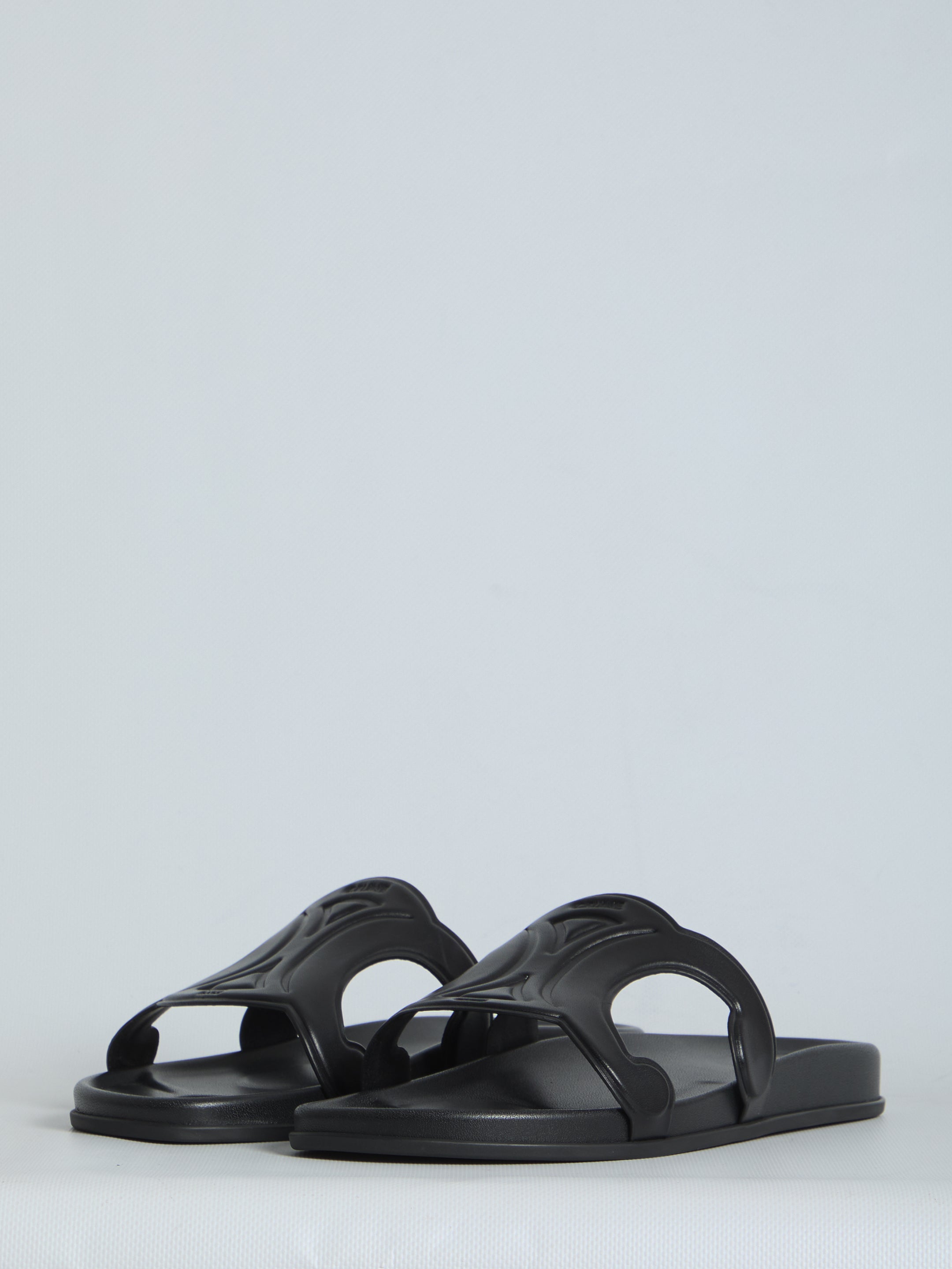 Black Celine Triomphe slide sandal, side profile view