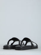 Black Celine Triomphe slide sandal showing leather insole detail