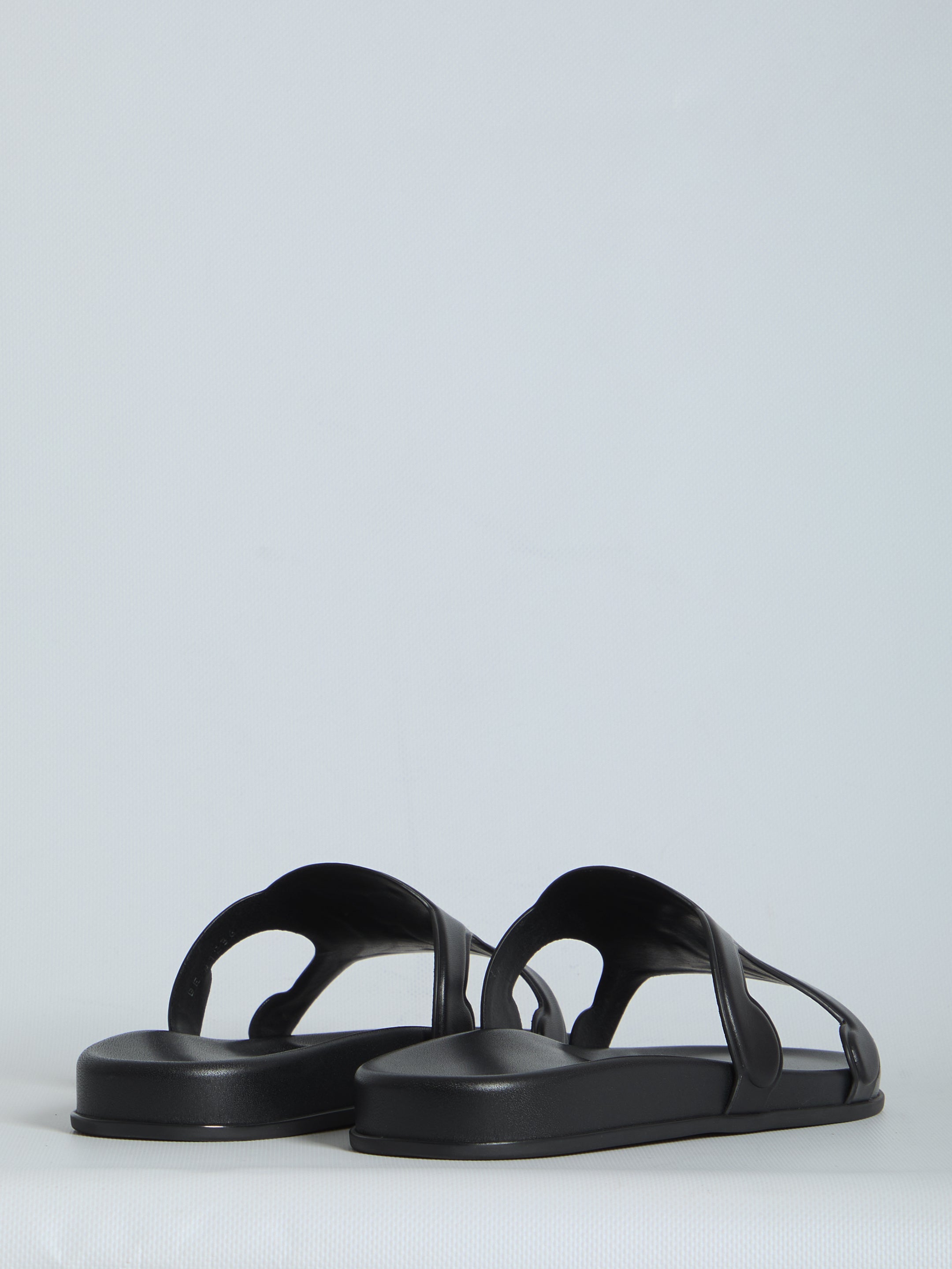 Black Celine Triomphe slide sandal showing leather insole detail