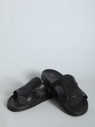 Black Celine Triomphe slide sandal, angled view by Celine