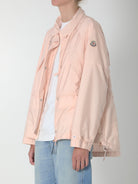 Light pink Moncler parka with adjustable drawstring collar, detail view