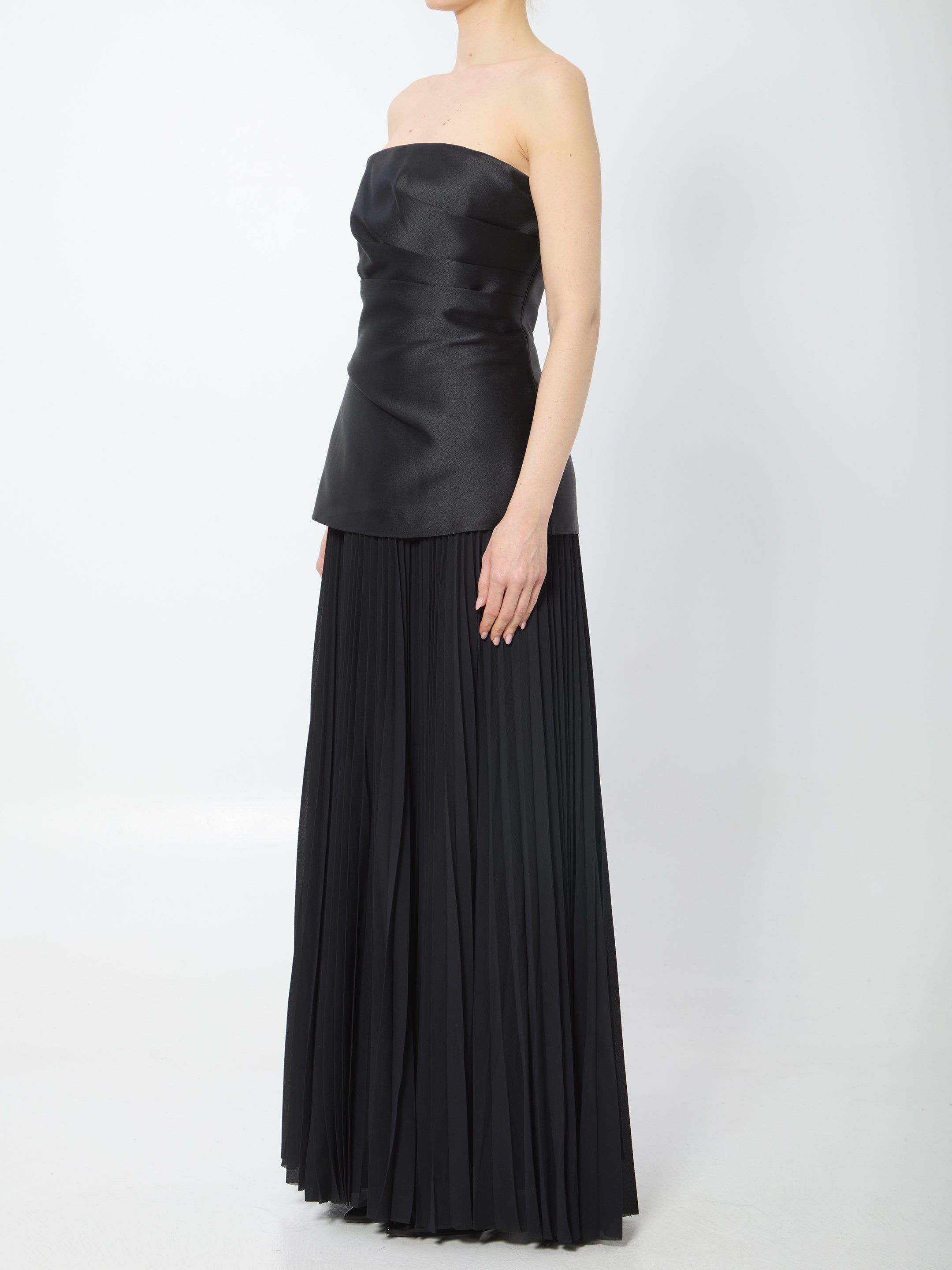 Black strapless maxi dress with pleated chiffon skirt by SOLACE London, side view