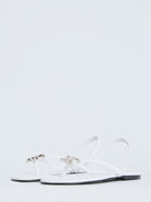 White Celine slider sandals with silver-tone Triomphe detail, front angle