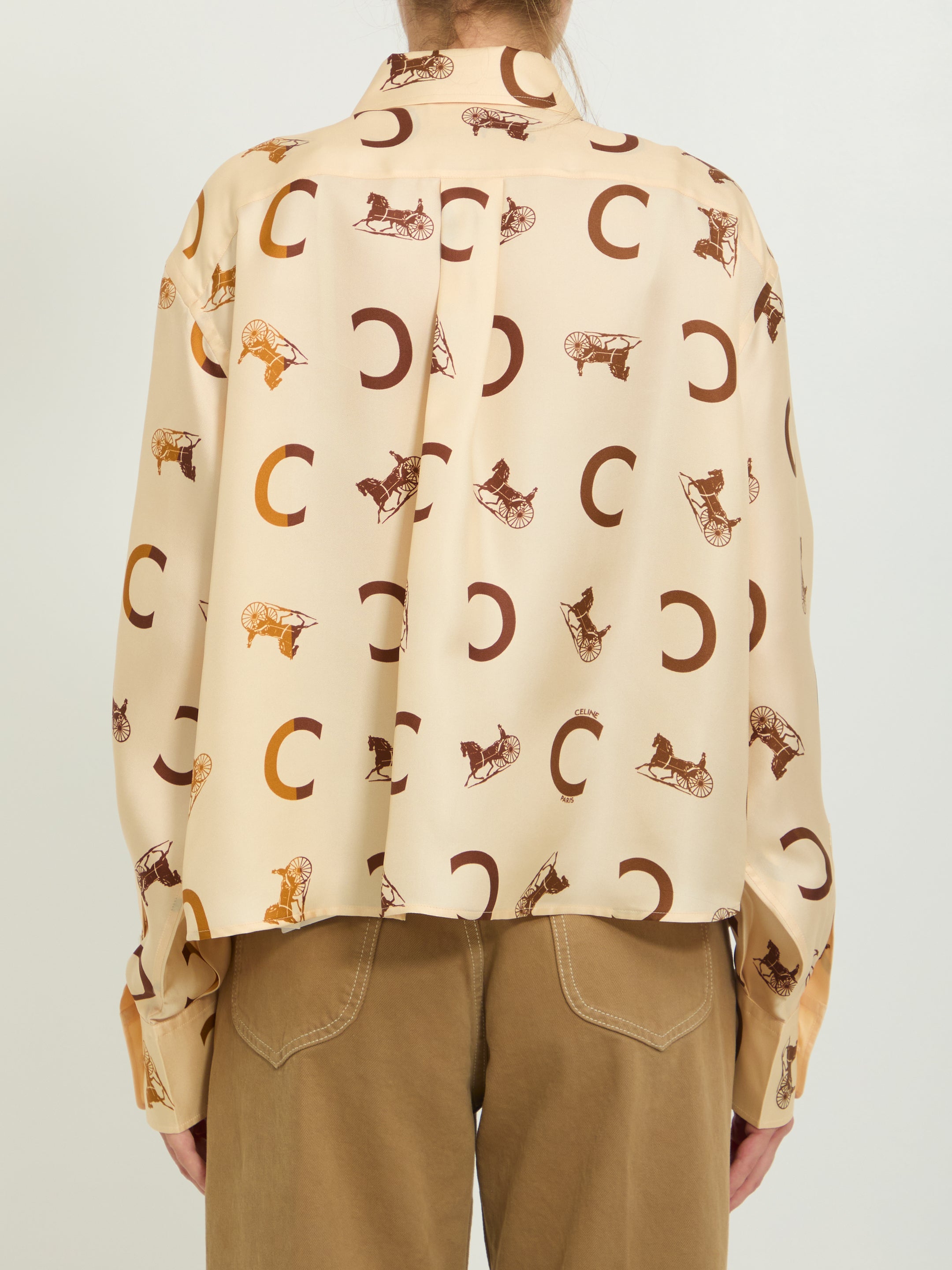 Cream Celine silk twill shirt detail showing pointed collar and button closure