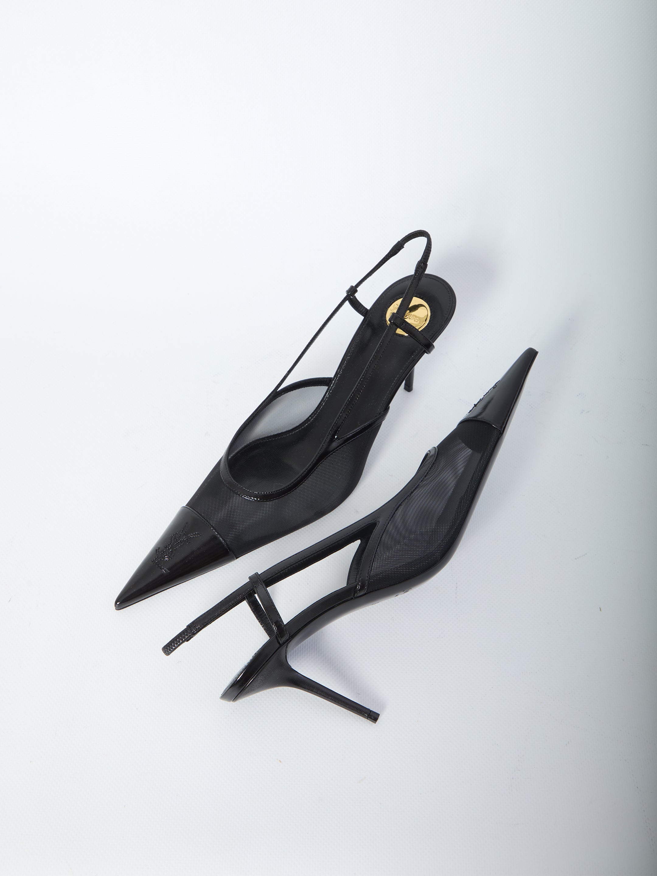 Saint Laurent Renée pump showing elongated toe and Cassandre embroidery, close-up
