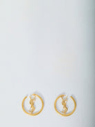 Gold-toned Saint Laurent Cassandre hoop earrings with inner decoration, front view