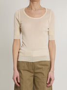 Pink Lemaire seamless top with trompe l'oeil effect, front view
