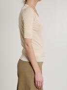 Pink Lemaire seamless top showing double sleeve detail, side view