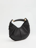 Black quilted calfskin Mombasa shoulder bag by Saint Laurent, side angle showing adjustable handle