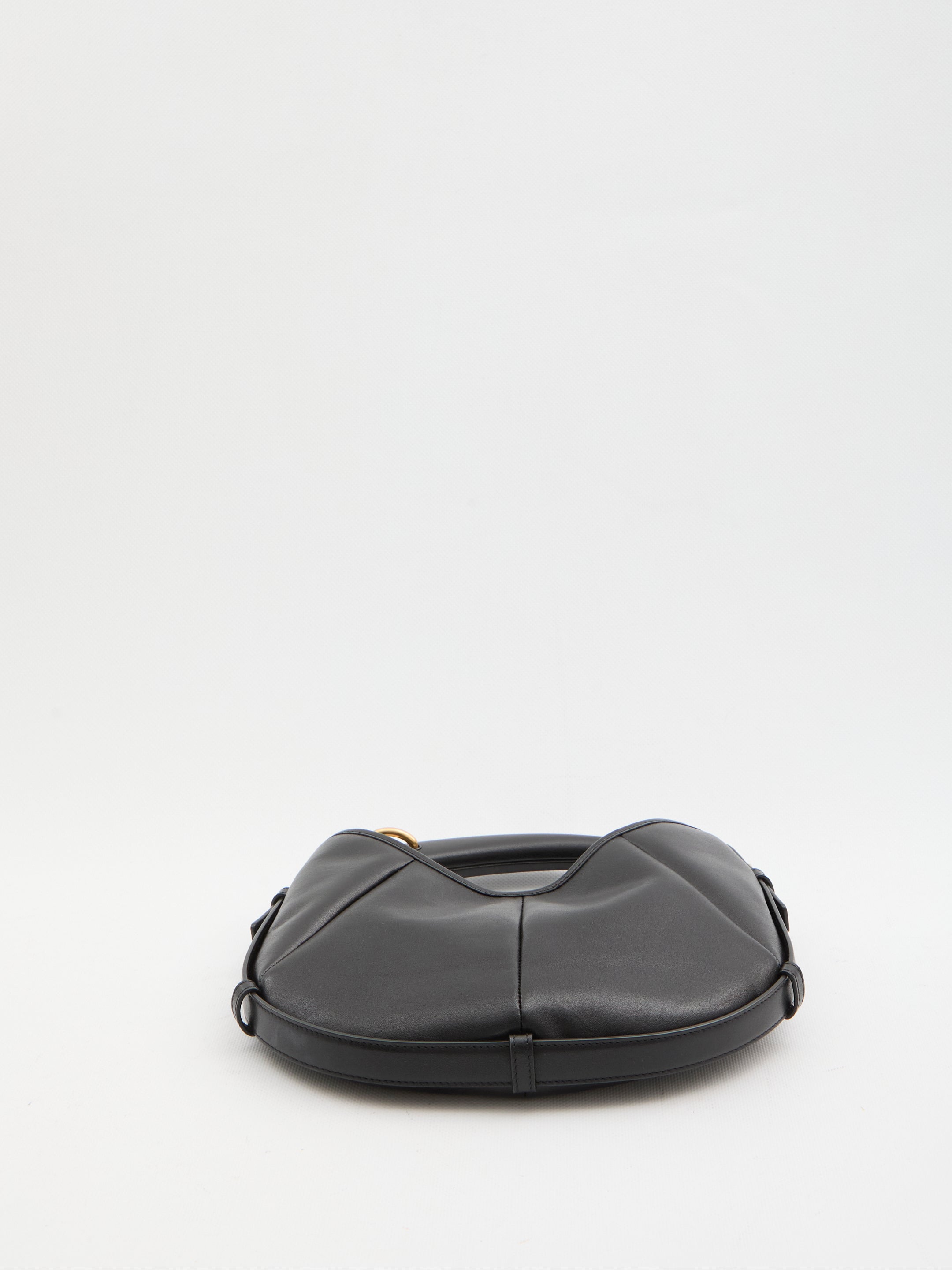 Black quilted calfskin Mombasa shoulder bag by Saint Laurent, back view with snap closure