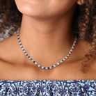 Sterling silver sapphire tennis necklace worn, lifestyle view by Lord & Taylor