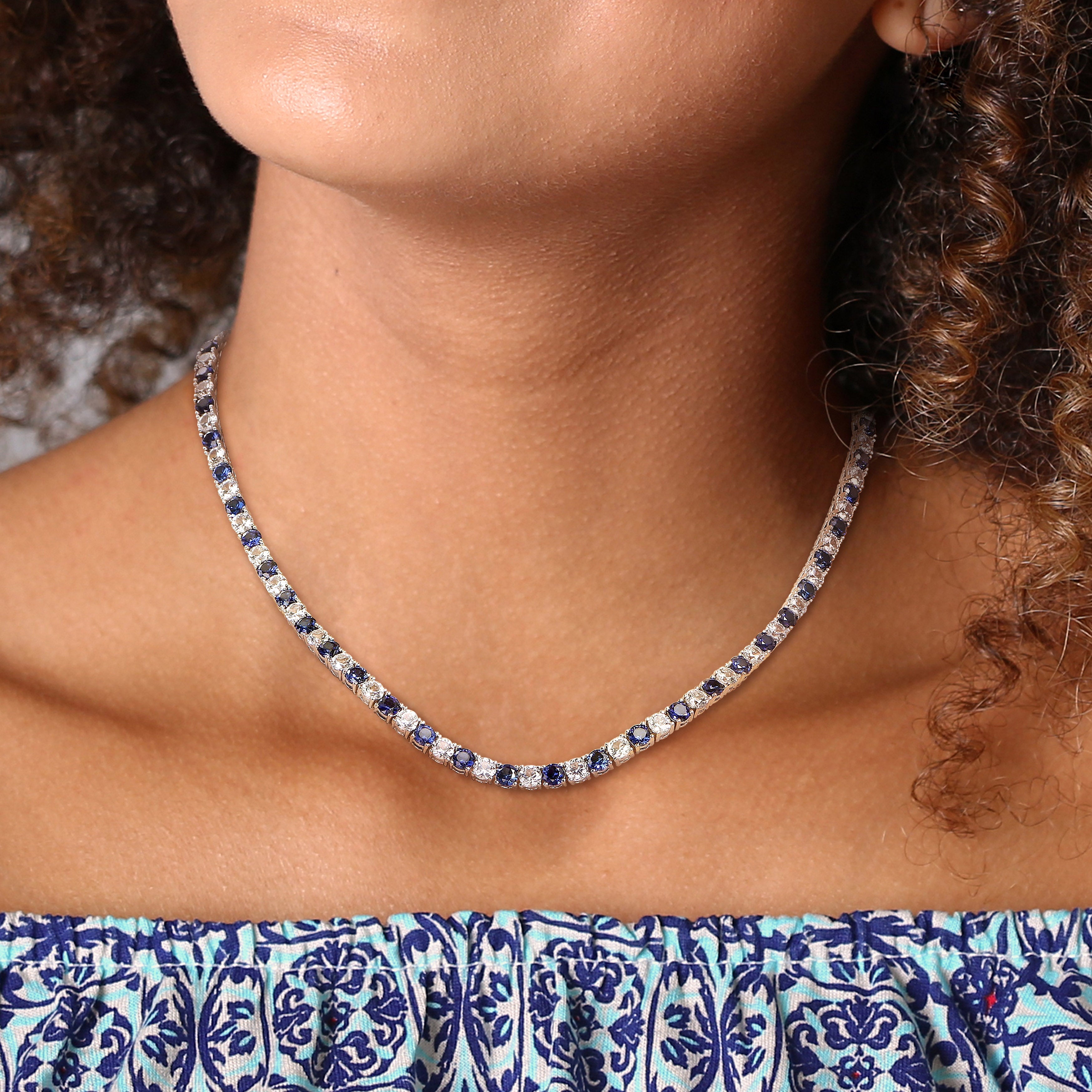 Sterling silver sapphire tennis necklace worn, lifestyle view by Lord & Taylor