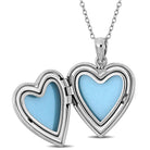 Sterling silver heart locket pendant necklace with floral design, open view showing interior