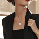 Sterling silver oval locket necklace worn on model by Lord & Taylor