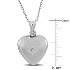 Sterling silver heart locket close-up showing cubic zirconia star detail by Lord & Taylor