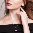 Sterling silver heart locket necklace worn on model by Lord & Taylor
