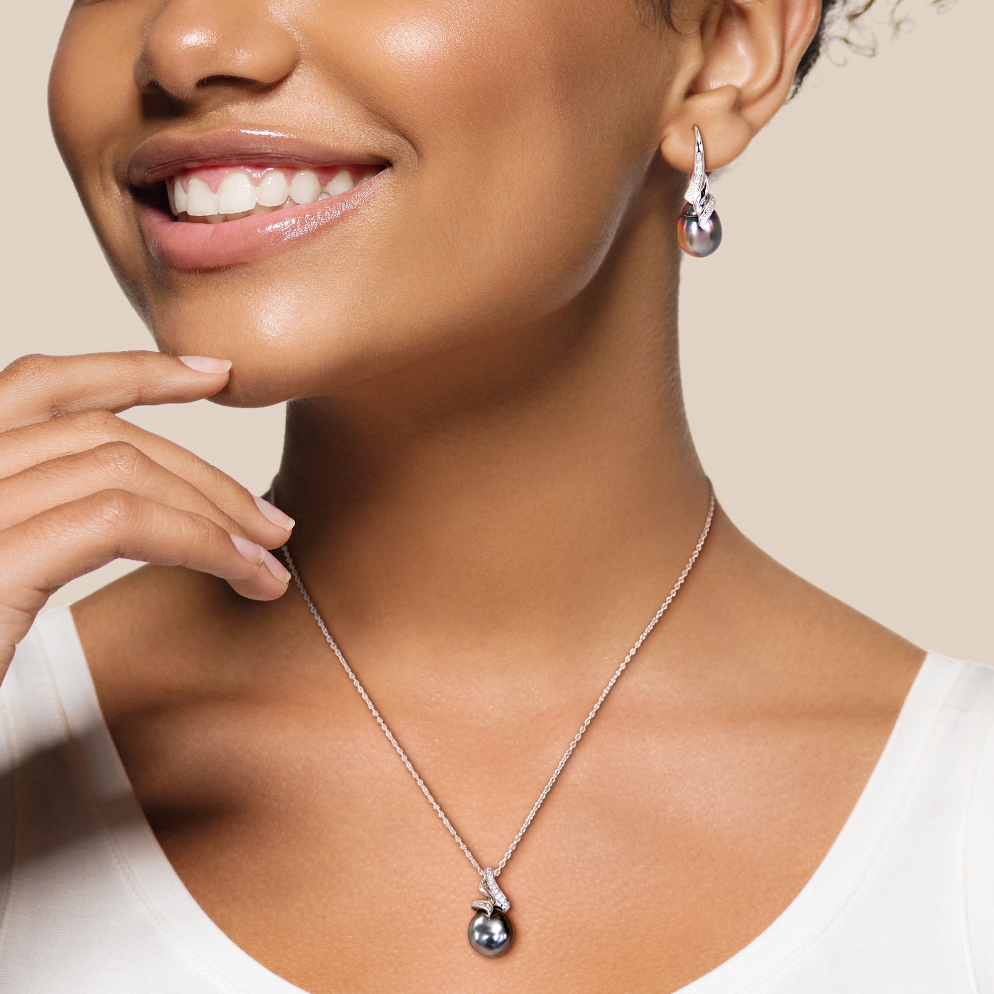 Black Tahitian pearl necklace and earring set worn, lifestyle view