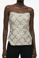 Champagne beige sequin bustier top styled with black trousers by Lord & Taylor Heritage