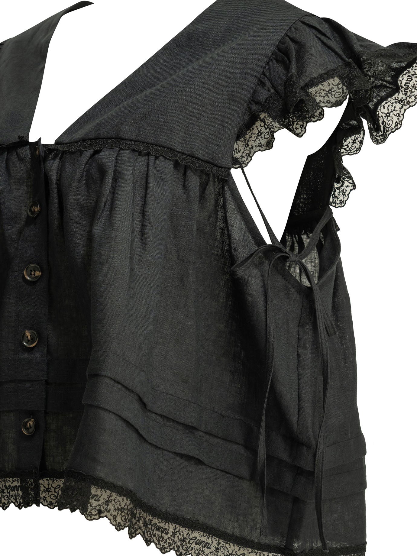 Black GANNI linen blouse detail showing lace trim finish, close-up