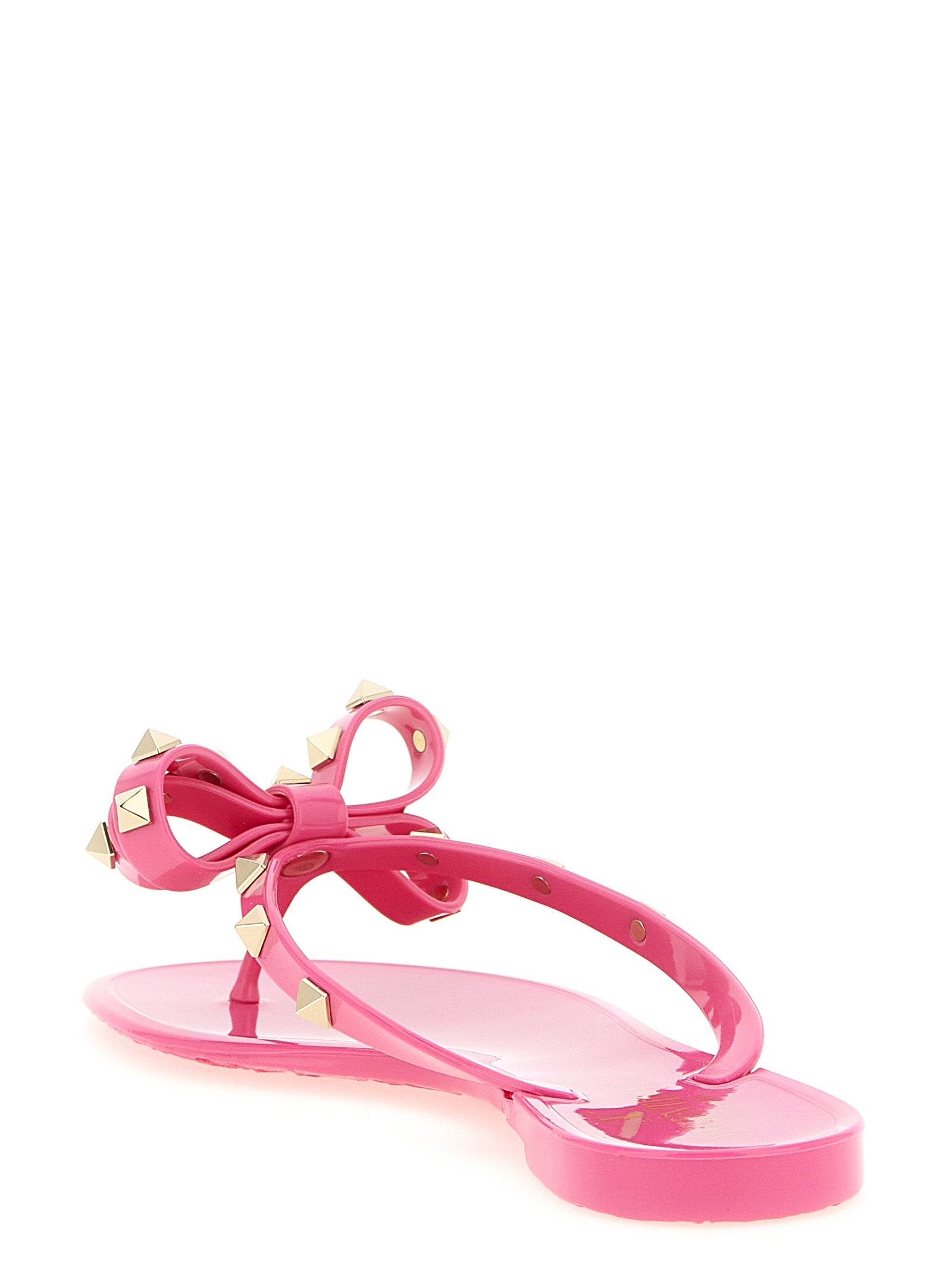 Fuchsia Rockstud flip flop sandals by Valentino Garavani, top view showing studs