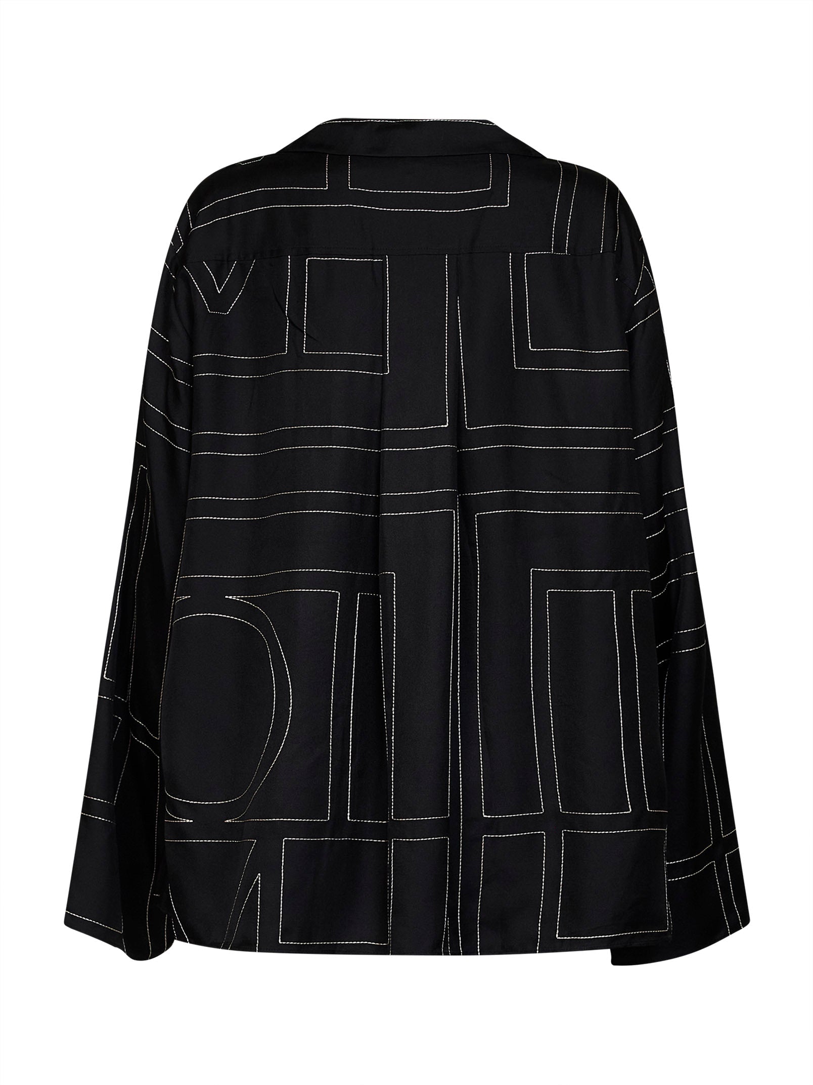Black TOTEME silk pajama shirt with lapel collar and mother-of-pearl buttons, detail view