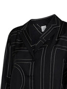 Black TOTEME silk pajama shirt with embroidered monogram pattern, back view