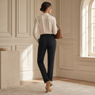 Black high-waisted trousers back view showing center crease and slim tapered leg by Lord & Taylor Heritage