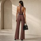 Burgundy halterneck jumpsuit with open back detail, rear view