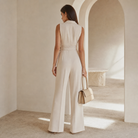 Cream sleeveless jumpsuit back view showing tailored collar by Lord & Taylor Heritage