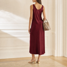 Burgundy satin slip dress back view showing bias-cut silhouette
