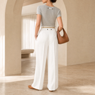Champagne satin wide-leg trousers back view showing pressed center crease