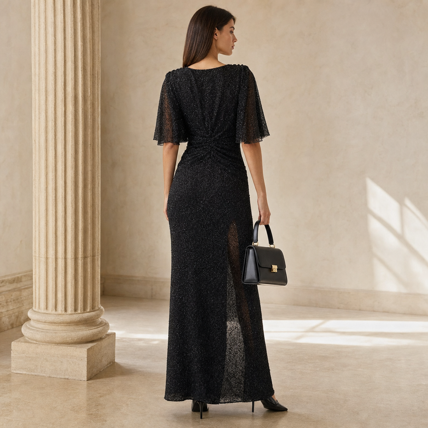 Black flutter-sleeve gown by Lord & Taylor Heritage, back view with draped shoulders